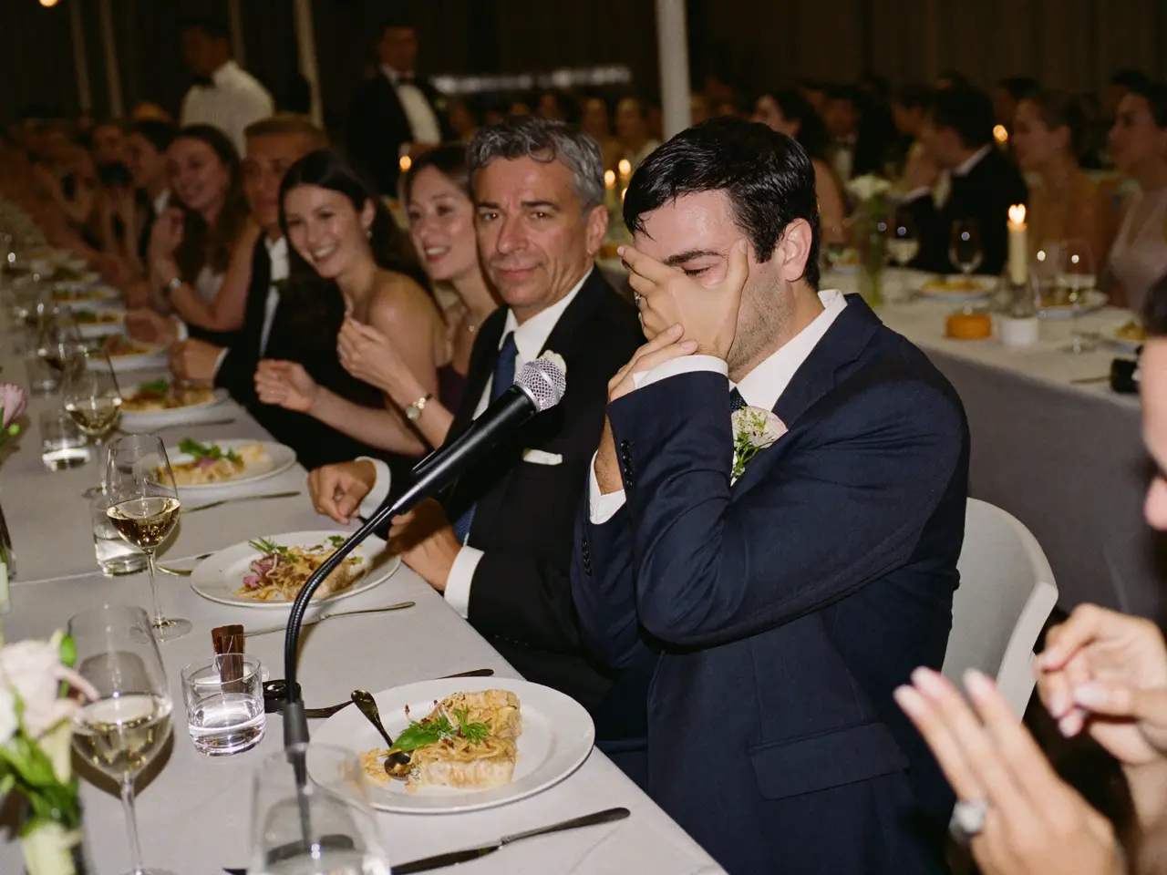 The best man mid-speech, the whole table laughing